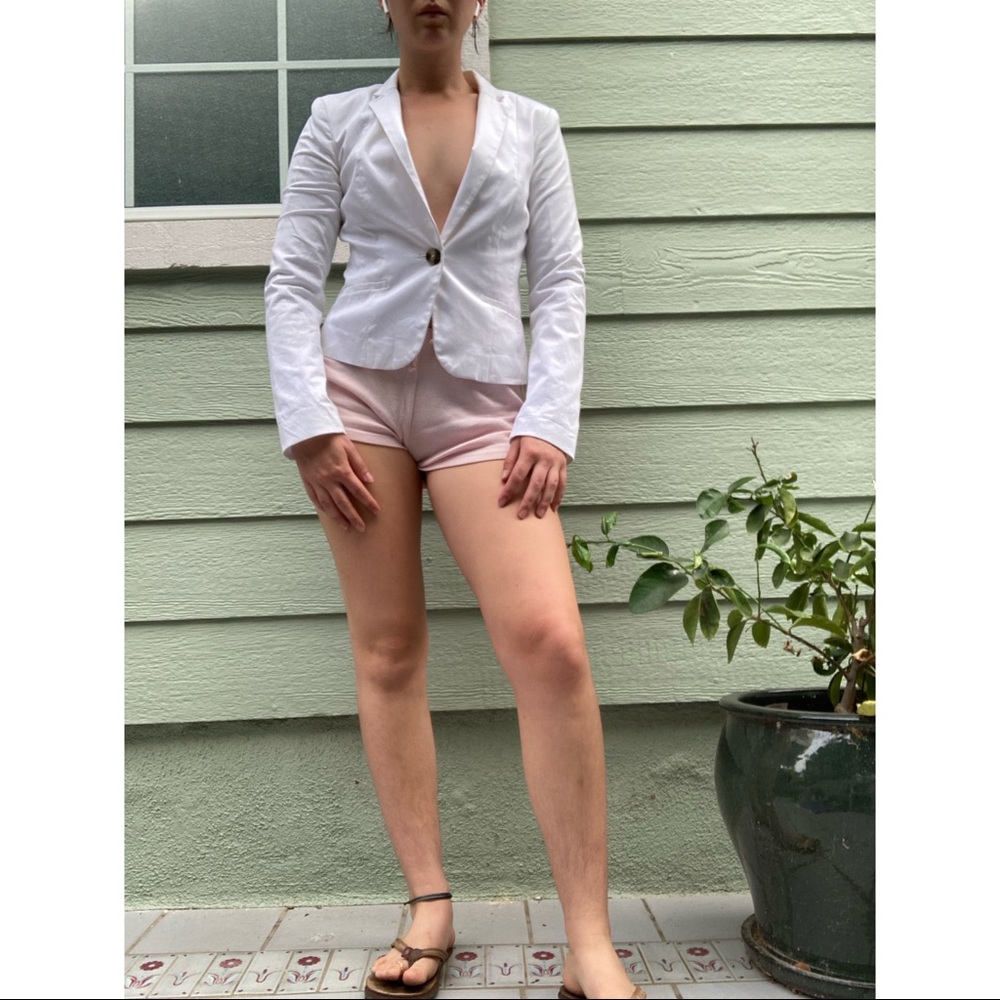 Cool white blazer to dress up or dress down! Tortoise shell button details.